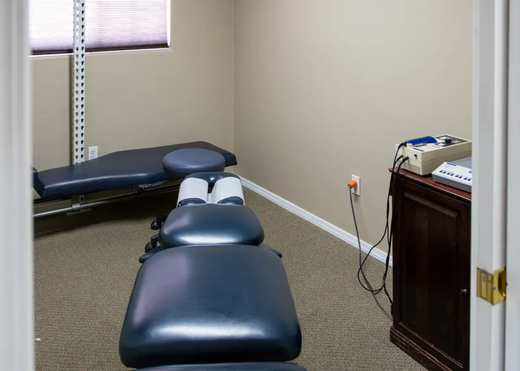 A private adjusting room with a chiropractic table