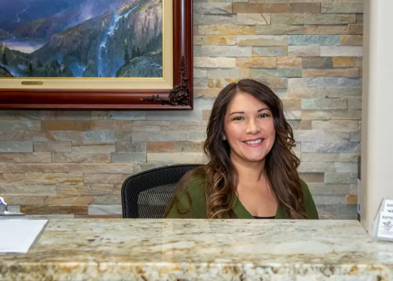 Smiling at the Haynes Chiropractic front desk